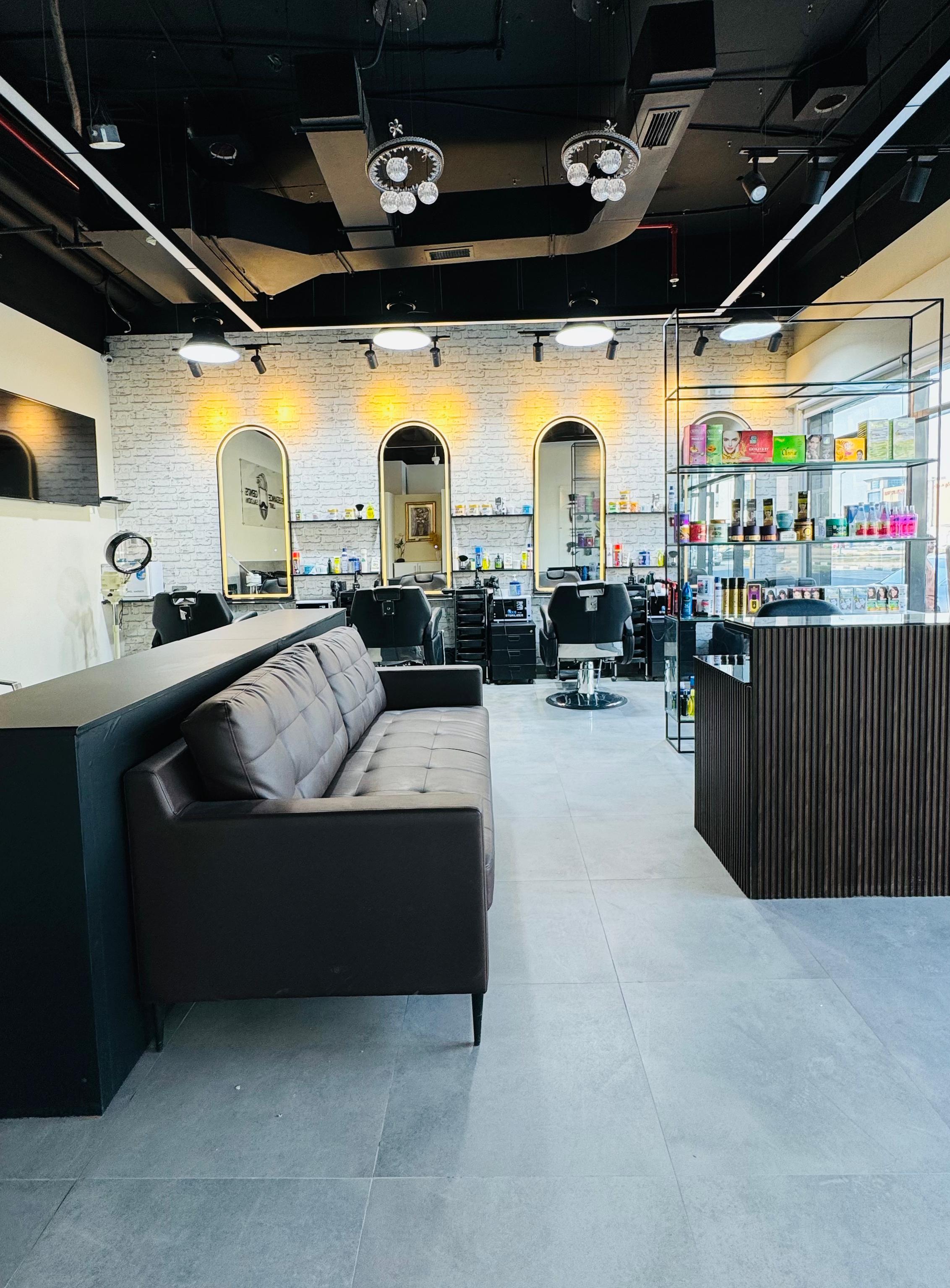 Waiting area with leather couch and products shelf